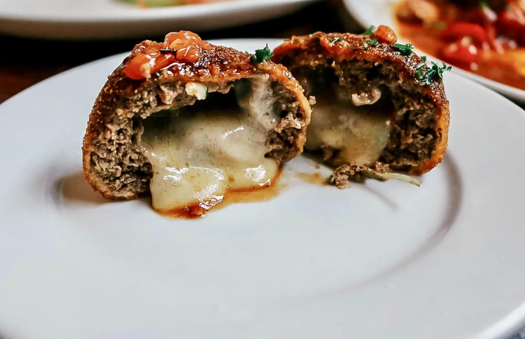 Arancini of the day, cut open to show the melting cheese centre