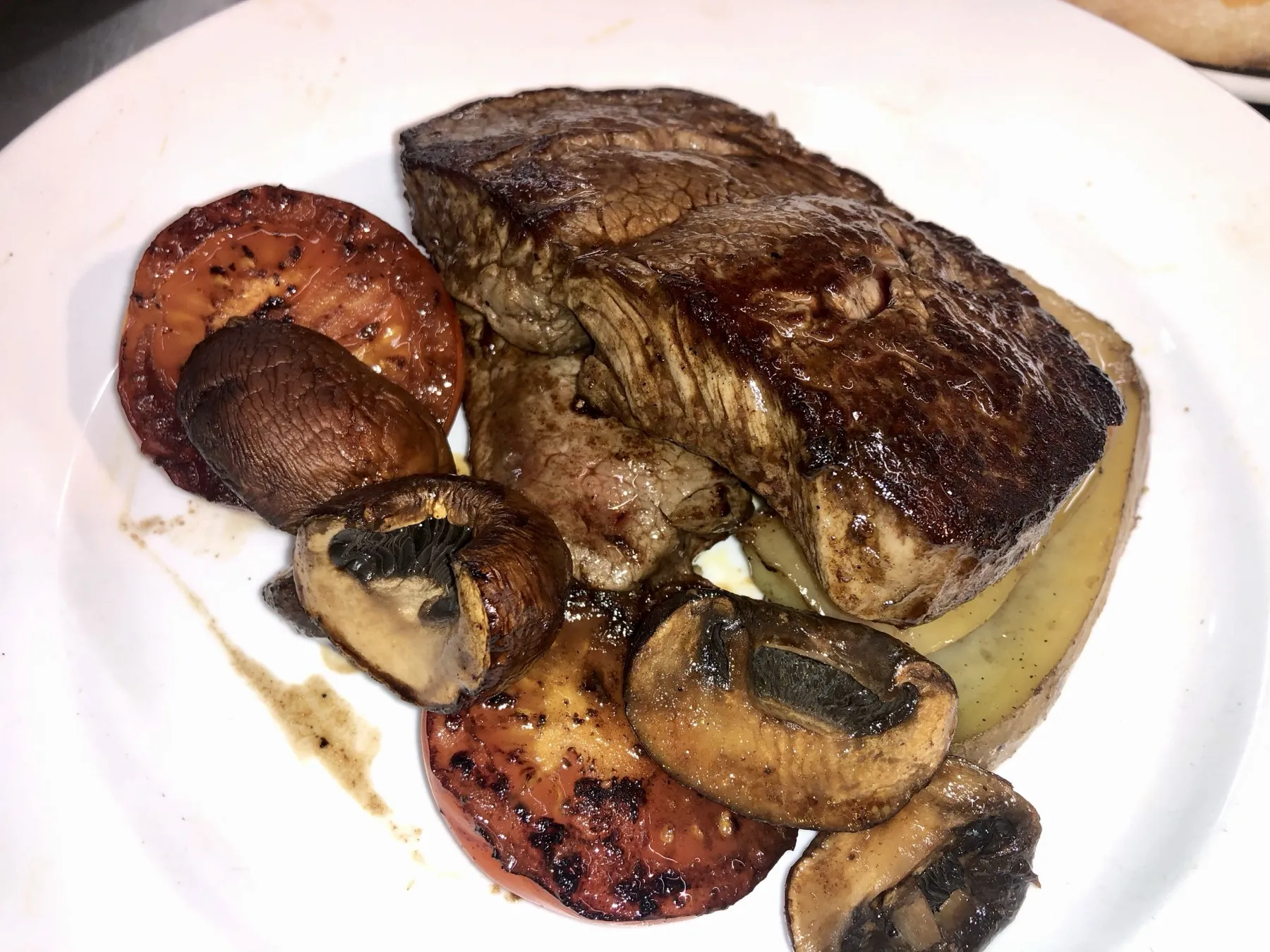 Fillet steak with roasted mushrooms and tomatoes