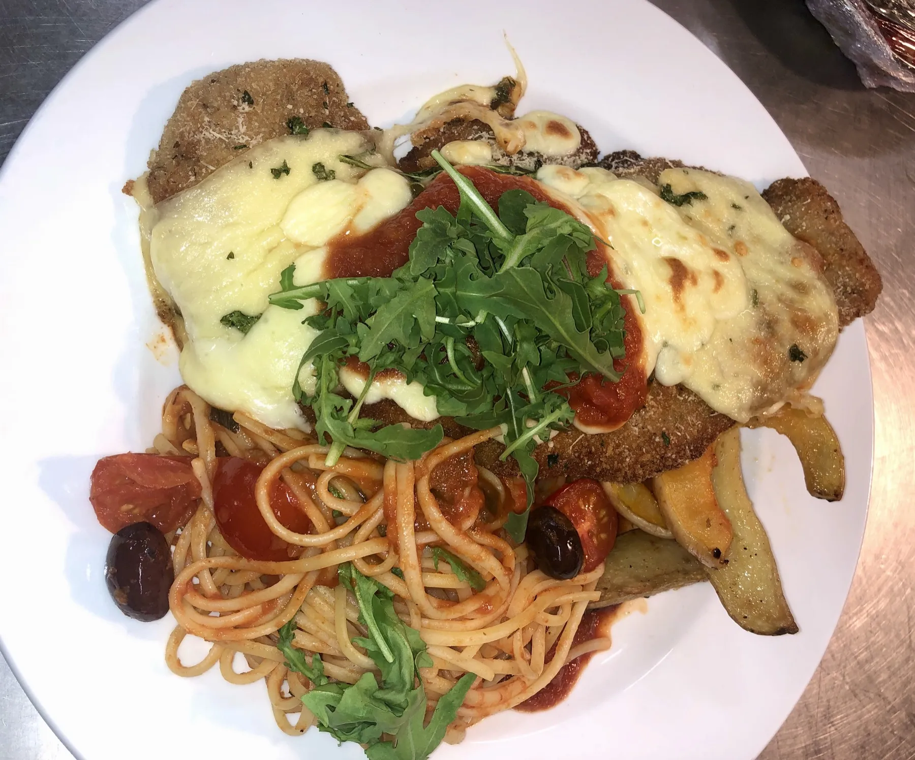 Breaded chicken milanese with linguine in tomato sauce